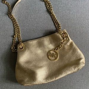Like new Michael Kors Gold Handbag